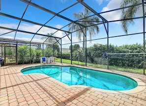 Private fenced in pool with outdoor seating