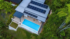 Refresh in your private pool with views of lush rainforest canopy