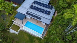 Refresh in your private pool with views of lush rainforest canopy