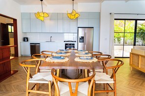 Gather for meals in a stylish, serene setting