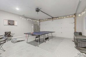 Enjoy a stylish game room in your luxury Nashville vacation rental! Perfect for ping pong, darts, bachelorette parties, or corporate retreats—experience fun and relaxation in your chic getaway!
