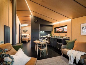 Lounge with logfire and full kitchen, everything you need for a relaxing stay