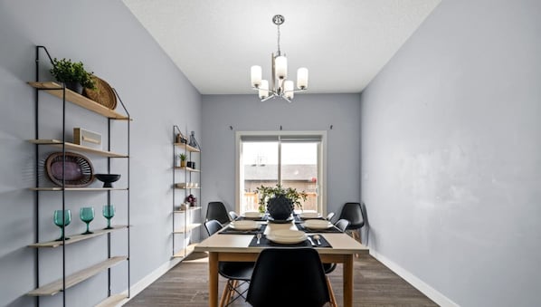 Enjoy the ease and simplicity of sharing a meal in this well-lit and functional dining area.