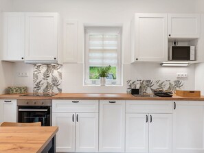 Kitchen, Countertop, Cabinetry, Kitchen Appliance, Interior Design, Furniture, Wood, Home, Flooring, Cupboard