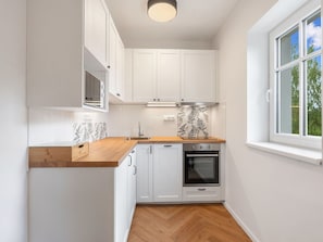 Kitchen Appliance, Kitchen, Countertop, Flooring, Interior Design, Major Appliance, Cabinetry, Wood, Floor, Furniture