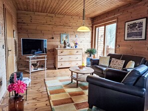 Furniture, Interior Design, Flooring, Wood, Floor, Couch, Ceiling, Living Room, Room, Chair