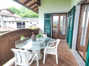 Furniture, Table, Outdoor Furniture, Flooring, Chair, Floor, Outdoor Table, Kitchen & Dining Room Table, Balcony, Shade