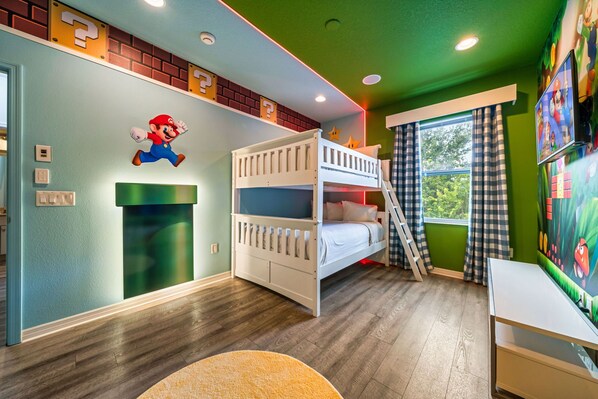 Bedroom 5 Mario Bros theme room with 2 double beds