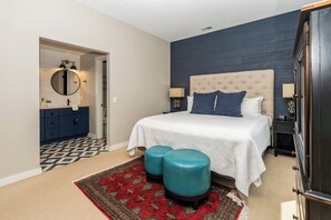 Tufted headboard. Velvet stools. Pure bliss.