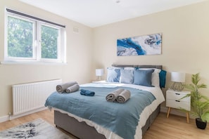 Comfortable double bedroom with fresh linen and towels provided.