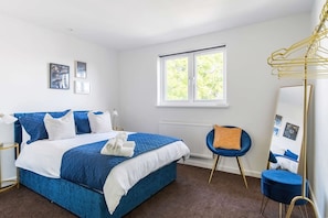 Comfortable double bedroom with fresh linen and towels provided.