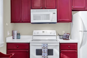 Rustic charm meets modern convenience in our fully stocked cottage kitchen