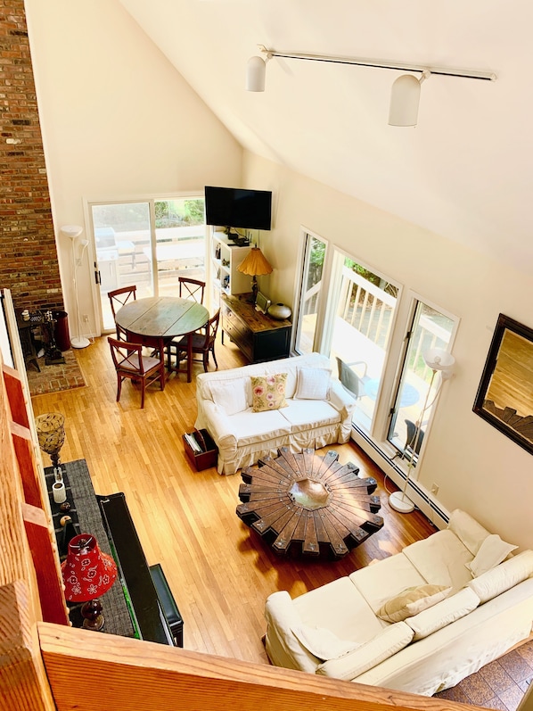 Upstairs looking down to the living room.35' soaring ceilings. Bright & Open