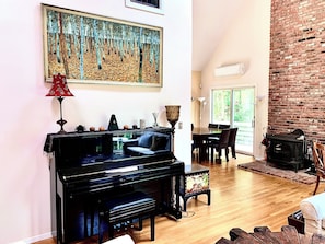 Living area with Yamaha piano.L shaped .