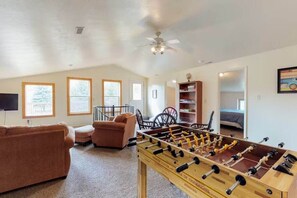 Game on in the upstairs loft — foosball fun for everyone.