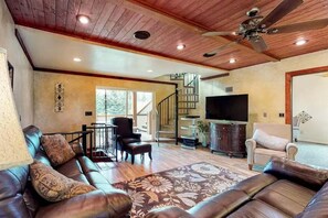 Main level living area with a smart TV and comfortable seating.