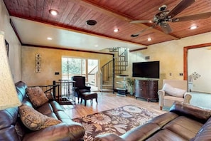 Main level living area with a smart TV and comfortable seating.