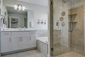 Walk-in shower and soaking tub in master bathroom.