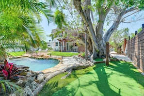 House Exterior | Private Lagoon Pool w/ Waterfall | 2-Hole Putting Green