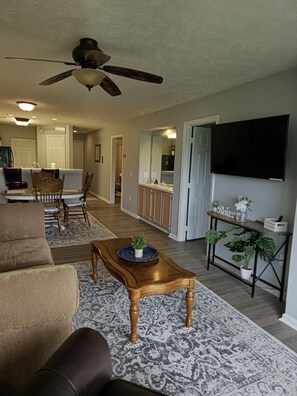 Open concept living room/dining room over looking the golf course