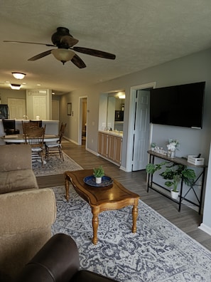 Open concept living room/dining room over looking the golf course