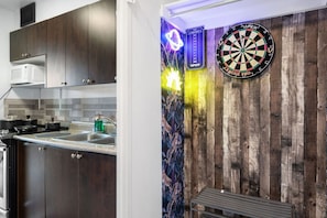 Bonus game nook featuring a dartboard and cozy ambiance.