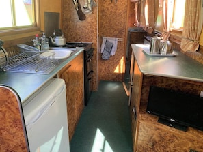 Bright galley with cooker fridge etc