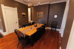 Up to 14 can seat comfortably for a family get together with 9 seats pictures, two more at a table in the kitchen, and 3 more bar stools.