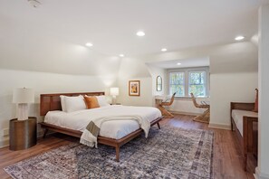 Loft bedroom. Complete with 1 King bed, 1 Twin bed and 2 getting ready stations. A full bathroom is available as well!