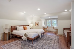 Loft bedroom. Complete with 1 King bed, 1 Twin bed and 2 getting ready stations. A full bathroom is available as well!
