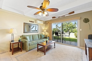 Bright and airy living space leading to a private outdoor area.
