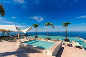 Unwind in the rooftop jacuzzi or infinity pool while taking in one of the best ocean views in town