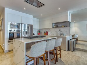 Kitchen — Fully-equipped with fridge, stove and oven