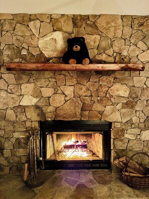 Wood burning stone fireplace in the living room