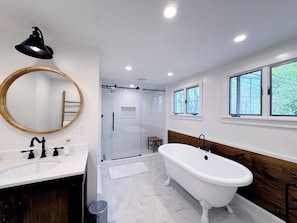 Full upstairs bathroom — located between one of the bedrooms.