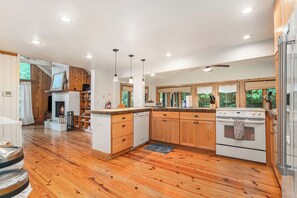 Kitchen opens directly to the cozy living room.