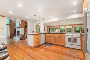 Kitchen opens directly to the cozy living room.