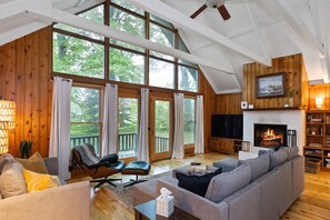 Charming A-frame design with large windows that fill the space with natural light and offer beautiful views.