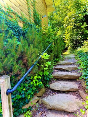 Step into nature! This charming stone staircase leads to a world of outdoor adventure and breathtaking views.