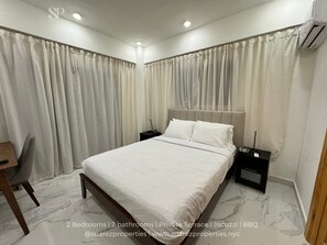 Main bedroom is powered by Alexa, an AC, a workstation, and an ensuite bathroom.