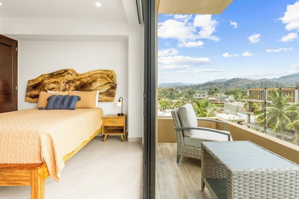 Indulge in the serene ambiance of the main suite, furnished with a plush queen bed, and an exclusive balcony.
