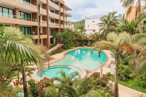 Pristine pool and a spacious hot tub for relaxation.
