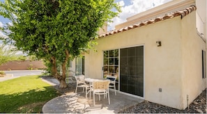 Relax on your private patio, ideal for enjoying meals outdoors in the stunning desert landscape just a stone's throw from El Paseo and the Living Desert Zoo.
