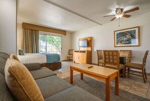 Unwind in a cozy living space featuring a kitchenette for your convenience, ideal for intimate meals or quick snacks during your desert escape.