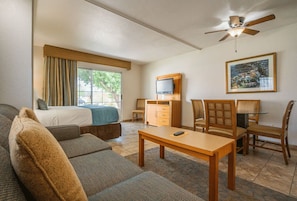 Unwind in a cozy living space featuring a kitchenette for your convenience, ideal for intimate meals or quick snacks during your desert escape.