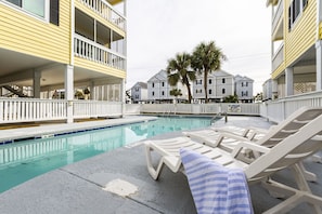 Dive into relaxation with a seasonal outdoor pool just steps away from your cozy condo at Sandy Shores III, perfect for families and groups.