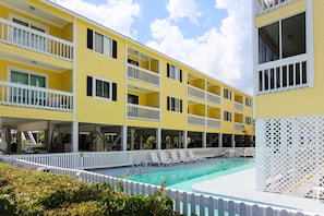 Experience resort-style living at Sandy Shores III with its inviting outdoor pool and well-maintained grounds, perfect for unwinding after a day at the beach.