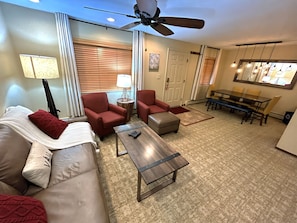 Enjoy a spacious living area with a sleeper sofa, perfect for family fun and relaxation after a day of mountain activities.