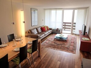 Furniture, Flooring, Floor, Interior Design, Couch, Wood, Living Room, Wood Flooring, Room, Ceiling