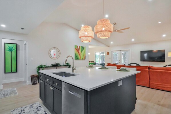 Open floorplan, large kitchen and island with seating. 
